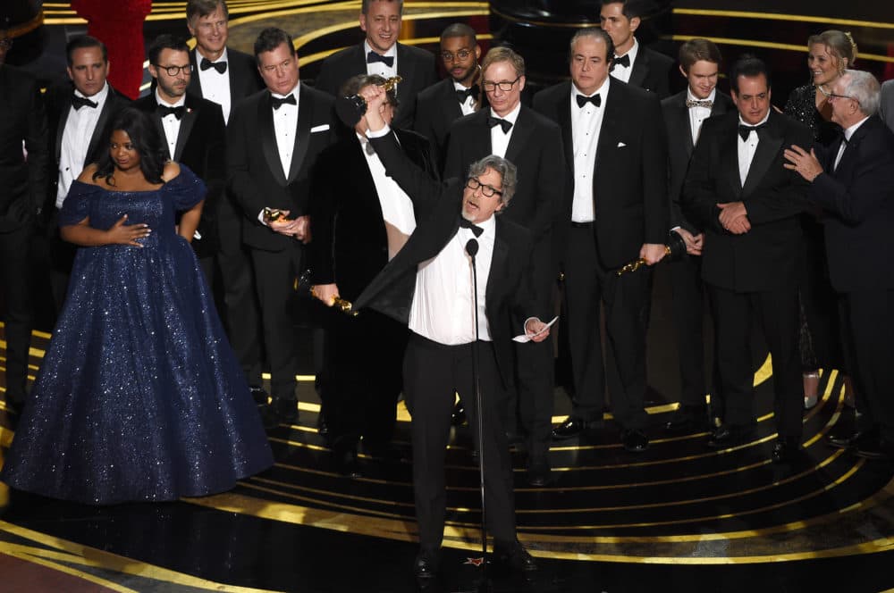 Peter Farrelly, center, and the cast and crew of "Green Book" accept the award for best picture. (Chris Pizzello/Invision/AP)
