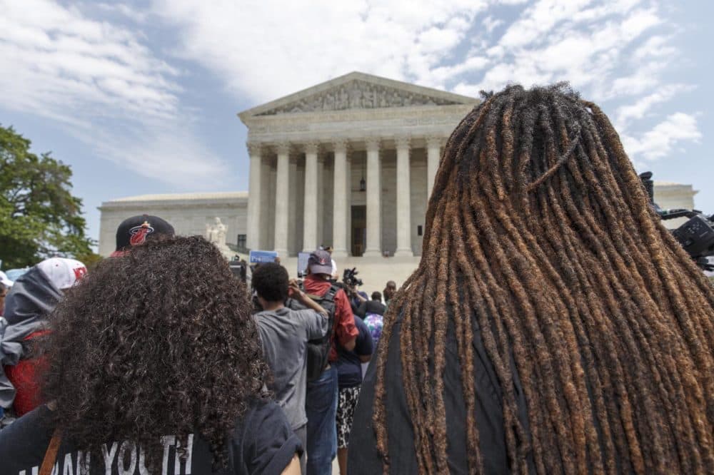 Students, parents and educators rally at the Supreme Court in Washington, Tuesday, May 13, 2014, on the 60th anniversary Brown v. Board of Education decision that struck down the separate but equal concept established under Plessy v. Ferguson that kept schools segregated. (AP Photo)