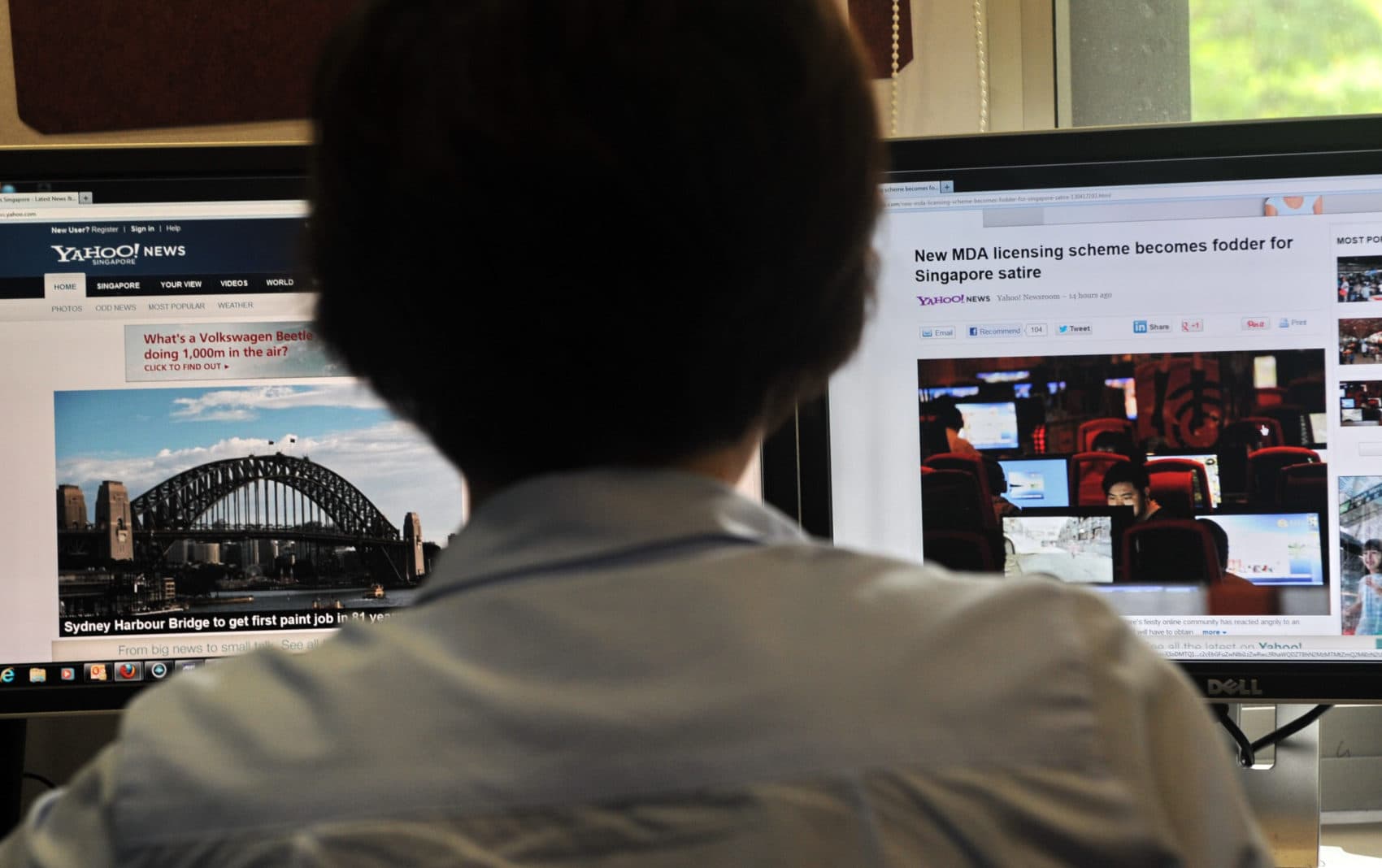 A person browses through media websites on a computer in Singapore.  (Roslan Rahman/AFP/Getty Images)
