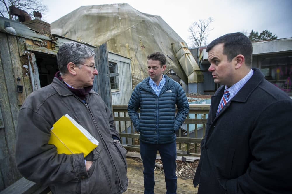 Mark Bogosian (center) and his attorneys at the geodesic dome. (Jesse Costa/WBUR)