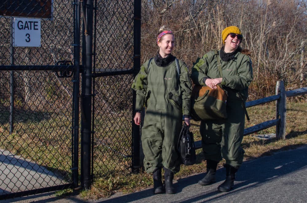 Brigid McKenna and Amy James wait to board their plane at the Provincetown Municipal Airport. (Sharon Brody/WBUR)