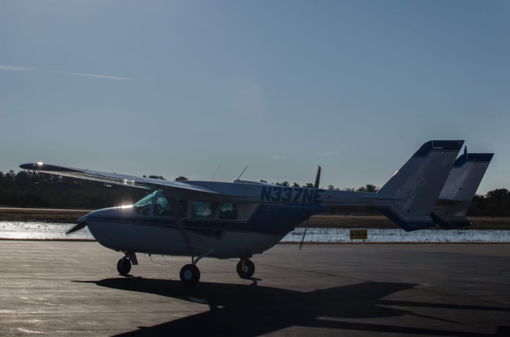 The aerial surveillance team conducts surveys in a tiny Cessna 337 0-2 Skymaster. (Sharon Brody/WBUR)