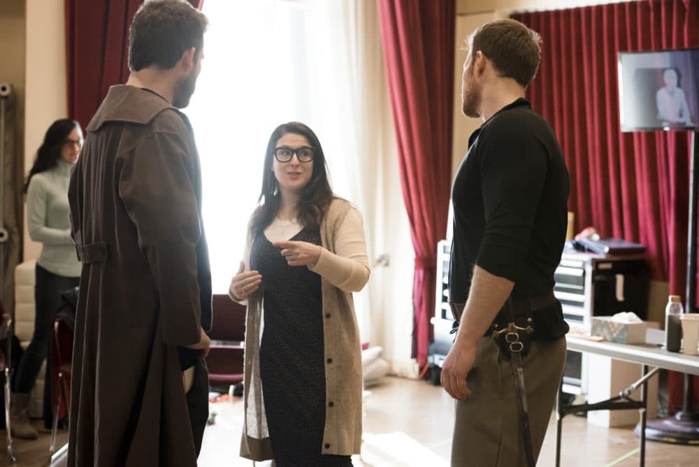 Director Sarna Lapine discusses a scene with Brandon Cedel and Duncan Rock. (Courtesy Liza Voll)