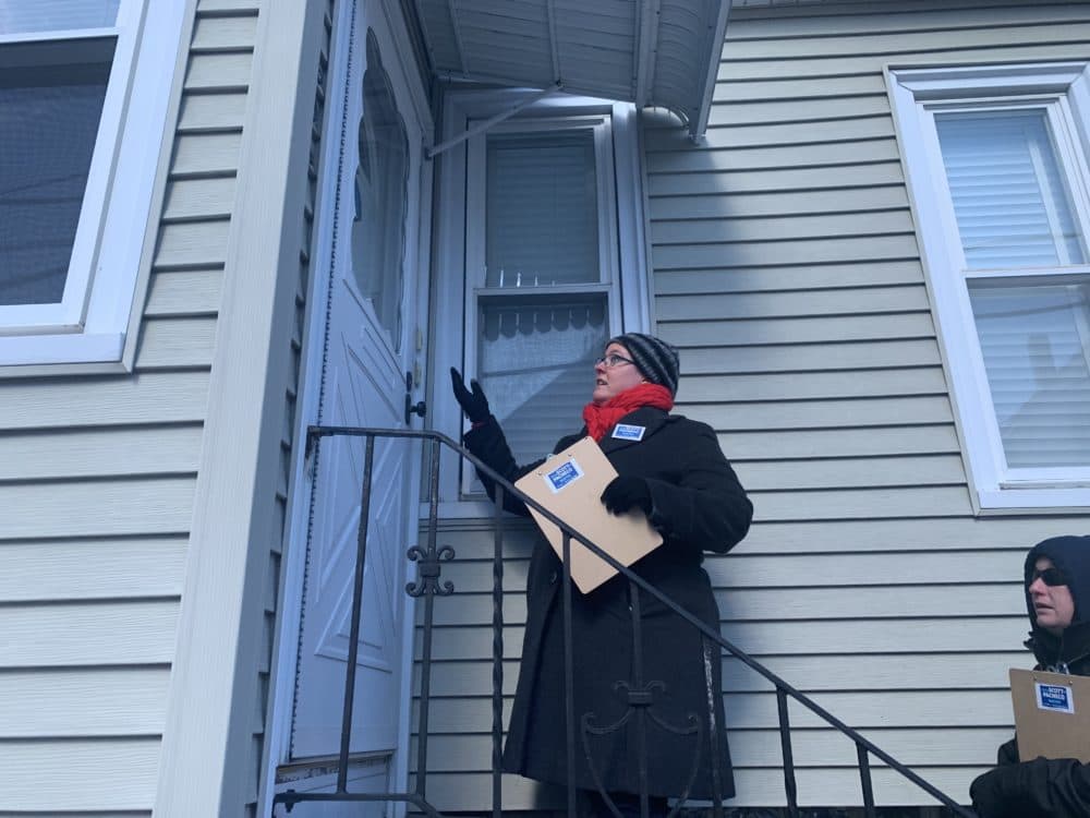 Nonprofit worker and mayoral candidate Erica Scott-Pacheco canvases registered voters on a freezing cold weekday morning in Fall River. (Simón Ríos/WBUR)