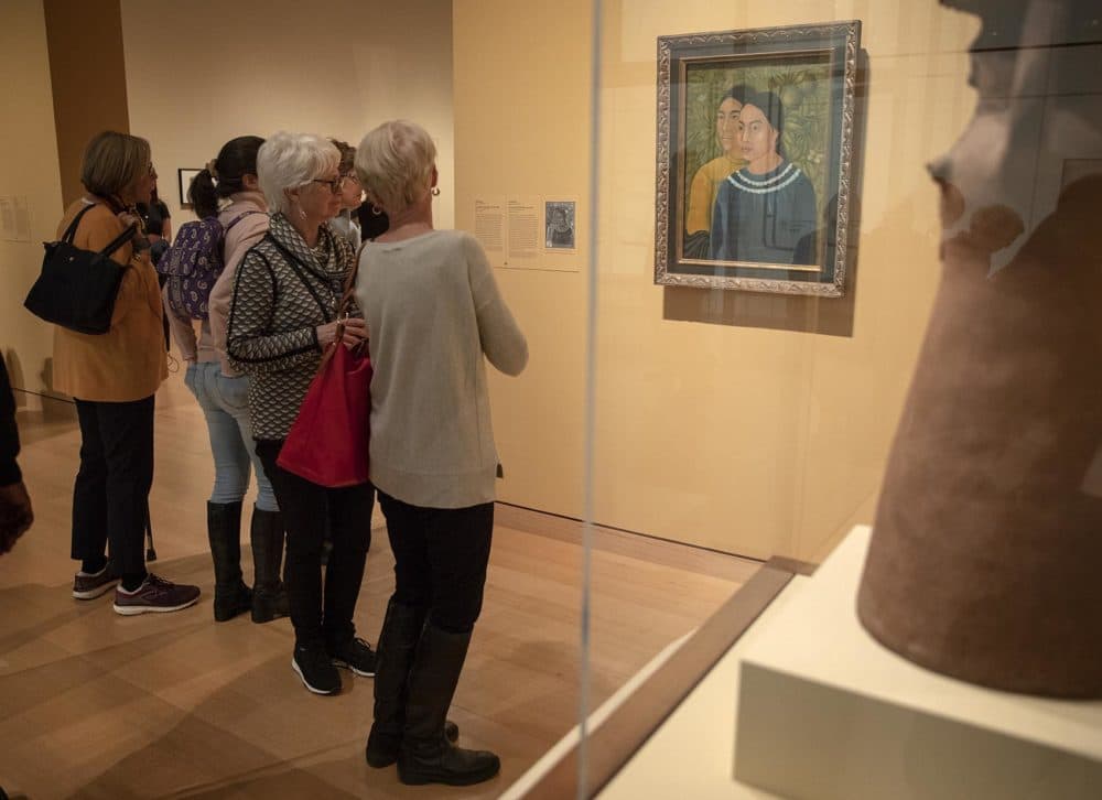 Visitors at the MFA Boston look at Frida Kahlo's "Dos Mujeres." (Robin Lubbock/WBUR)
