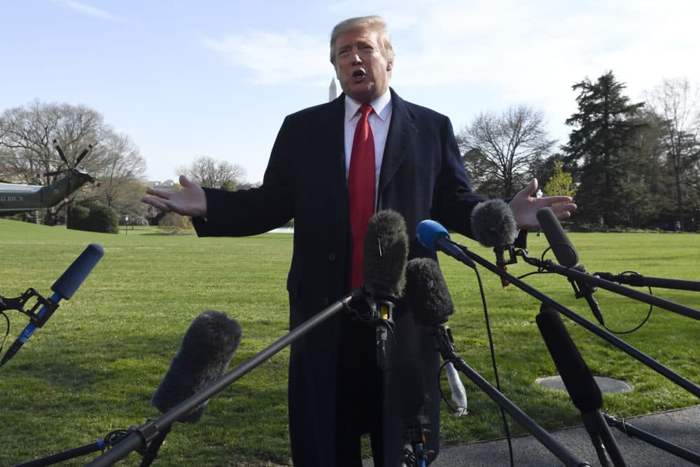 President Trump talks with reporters before boarding Marine One on the South Lawn of the White House in Washington. (Susan Walsh/AP)