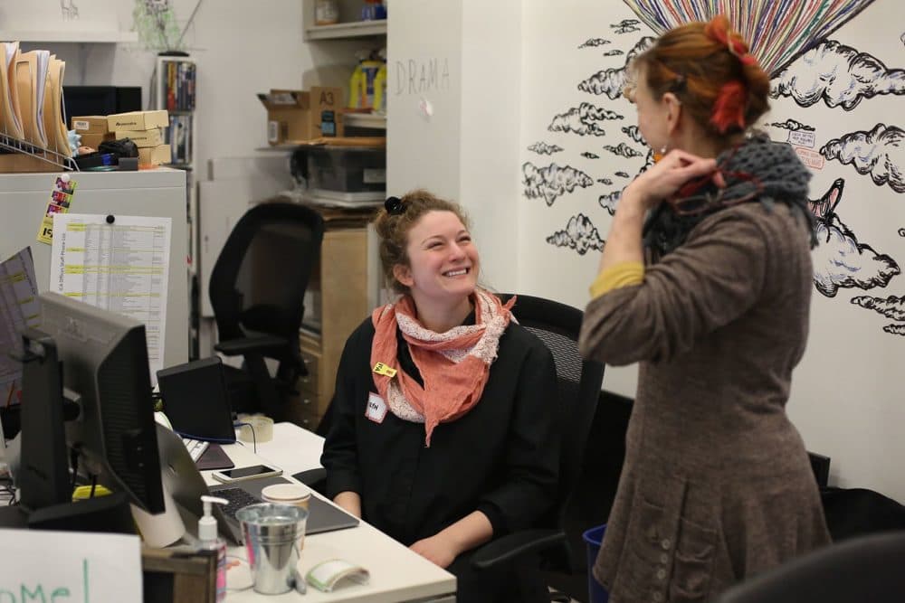 Volunteer Karyn Georgilis, left, checks in participant Liz LaManche during the ICA's Edit-A-Thon. (Hadley Green for WBUR)