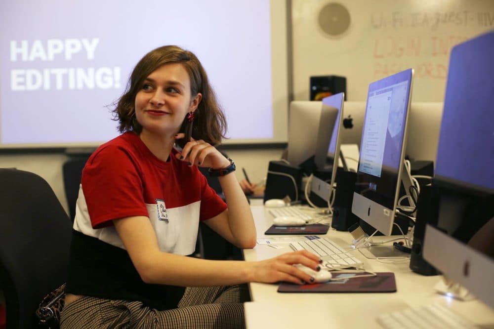 Olivia Lavoie, of Methuen, listens to instructions the ICA's Edit-A-Thon. (Hadley Green for WBUR)