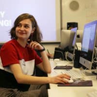 Olivia Lavoie, of Methuen, listens to instructions the ICA's Edit-A-Thon. (Hadley Green for WBUR)