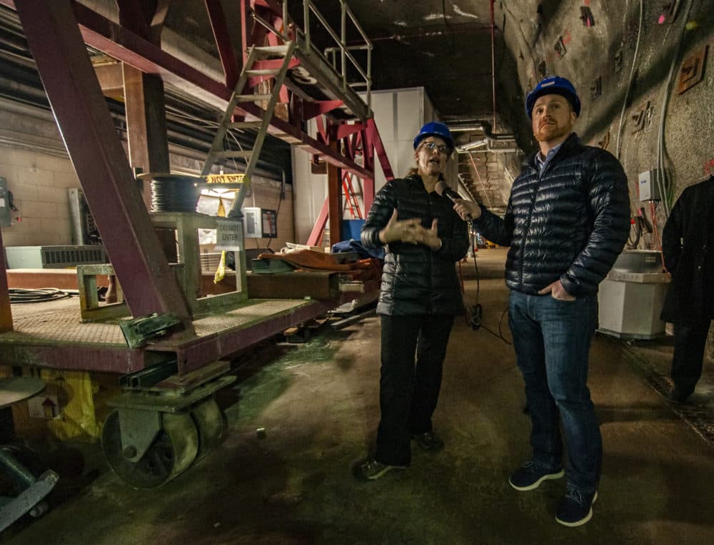 Fermilab's Bonnie Fleming (left) speaking with Here & Now's Jeremy Hobson 300 feet underground. (Chris Bentley/Here & Now)