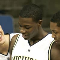 Kendric Price, center, with other University of Michigan basketball players, in this 2006 file photo (Paul Sancya/AP)