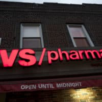 FILE- This Dec. 3, 2017, file photo shows a CVS Pharmacy in the Brooklyn borough of New York. CVS Health reports earnings Wednesday, Aug. 8, 2018. (AP Photo/Mark Lennihan, File)