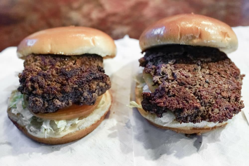 On the left, a conventional beef burger. On the right, "The Impossible Burger," a plant-based burger containing wheat protein, coconut oil and potato protein among. (Nati Harnik/AP)