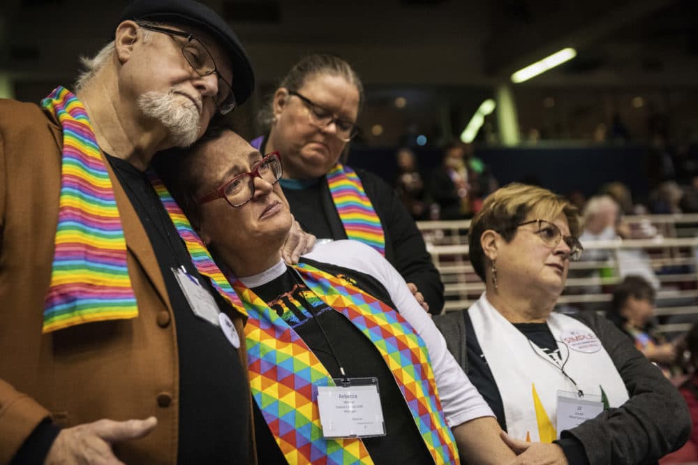 Ed Rowe, left, Rebecca Wilson, Robin Hager and Jill Zundel, react to the defeat of a proposal that would allow LGBT clergy and same-sex marriage within the United Methodist Church. (Sid Hastings/AP)