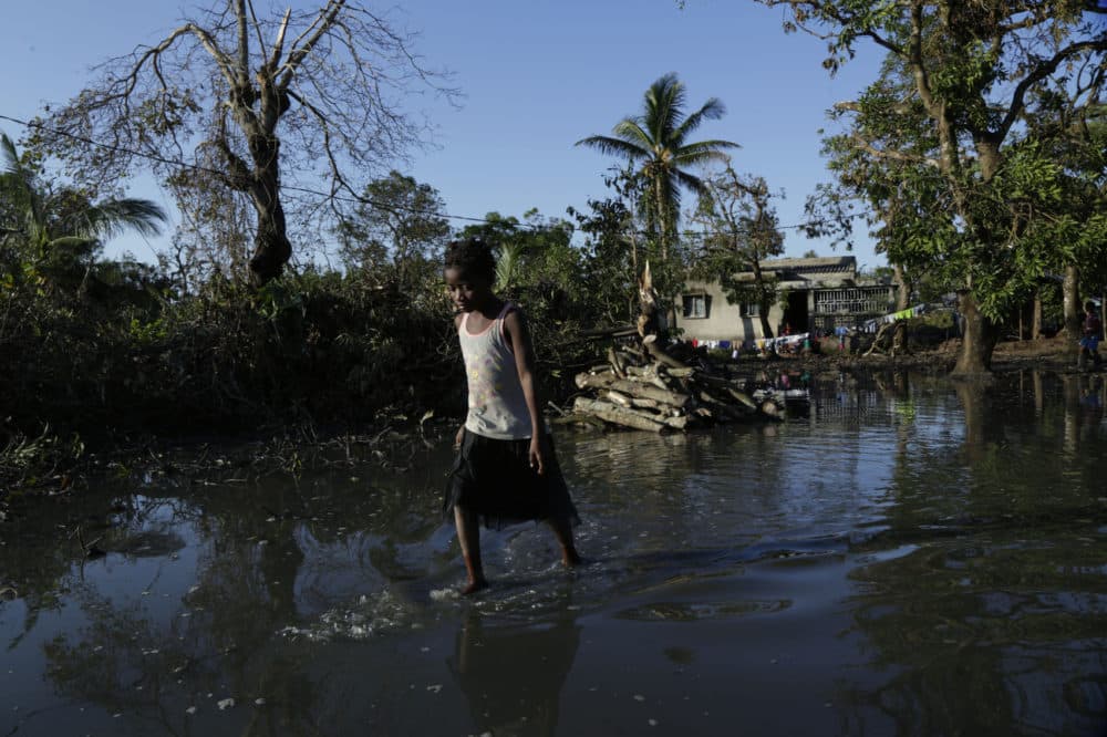 A young girl walks in the water at Mafambisse, about 60km outside of Beira, Mozambique, Tuesday, March 26, 2019. (Themba Hadebe/AP)