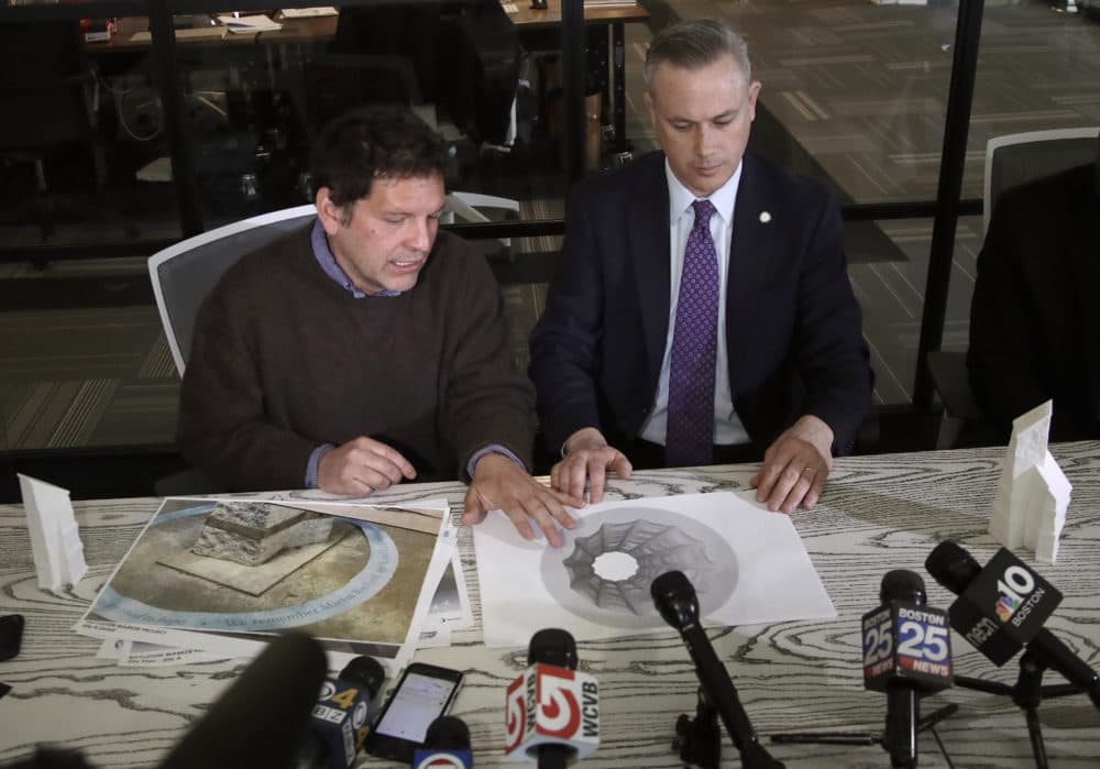 Artist Pablo Eduardo, left, speaks about his ongoing work on the memorial. Listening at right is Boston's Chief of Operations Patrick Brophy. (Elise Amendola/AP)
