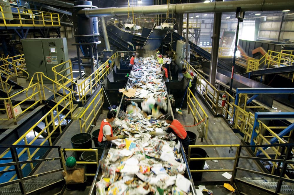 Workers sort materials at Casella's facility in Auburn. (Courtesy of Casella)