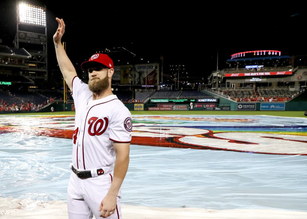 Bryce Harper waves to the crowd following the last Nationals home game of the 2018 season. Harper signed with the Philadelphia Phillies this week. (Rob Carr/Getty Images)