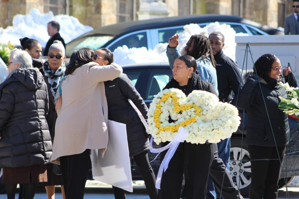 The mourners gather at the funeral of 23-year-old Jassy Correia in Dorchester on March 9, 2019. Correia was kidnapped at the end of last month and found dead a few days later in Delaware. (Quincy Walters / WBUR)