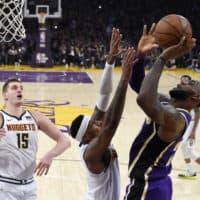 Los Angeles Lakers forward LeBron James scores during Wednesday's game in Los Angeles. With that basket, James moved past Michael Jordan for fourth place on the NBA career scoring list. (Mark J. Terrill/AP)