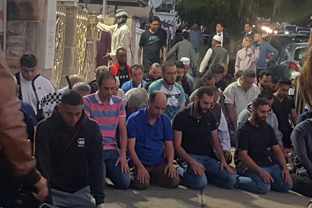 Worshippers pray for victims and families of the Christchurch shootings during an evening vigil a the Lakemba Mosque, Friday, March 125, 2029, in Wakemba, New South Wales, Australia. At least 49 people have been killed in mass shootings as worshippers gathered for Friday prayers in two New Zealand mosques. (Mark Goudkamp via AP)