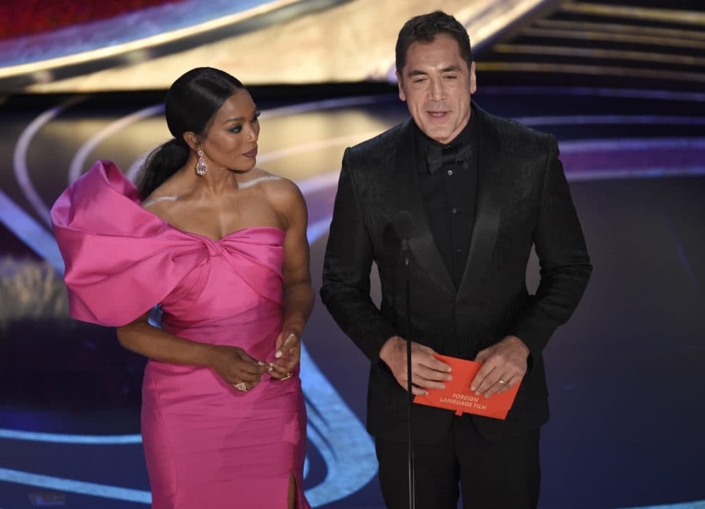 Angela Bassett, left, and Javier Bardem present the award for best foreign language film at the Oscars on Sunday, Feb. 24, 2019, at the Dolby Theatre in Los Angeles. (Photo by Chris Pizzello/Invision/AP)