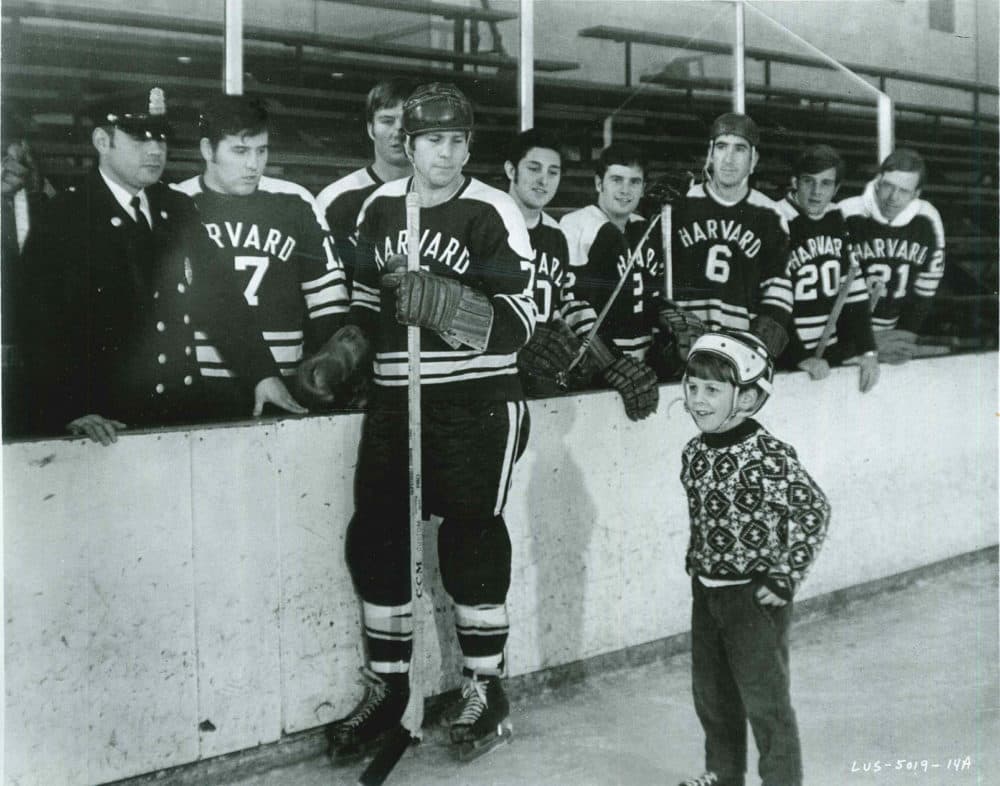 Ryan O'Neal dons his Harvard hockey uniform for the movie "Love Story." Bill Cleary III is in foreground. (Courtesy Bill Cleary)