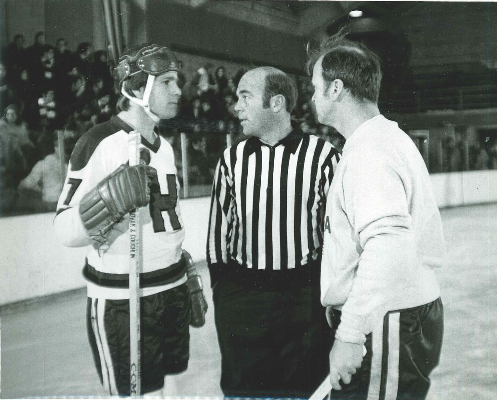 Ryan O'Neal (left) on the set of "Love Story", taking advice (or not) from skating advisers Bob Cleary (in ref's jersey) and his brother, Bill Cleary. (Courtesy Bill Cleary)