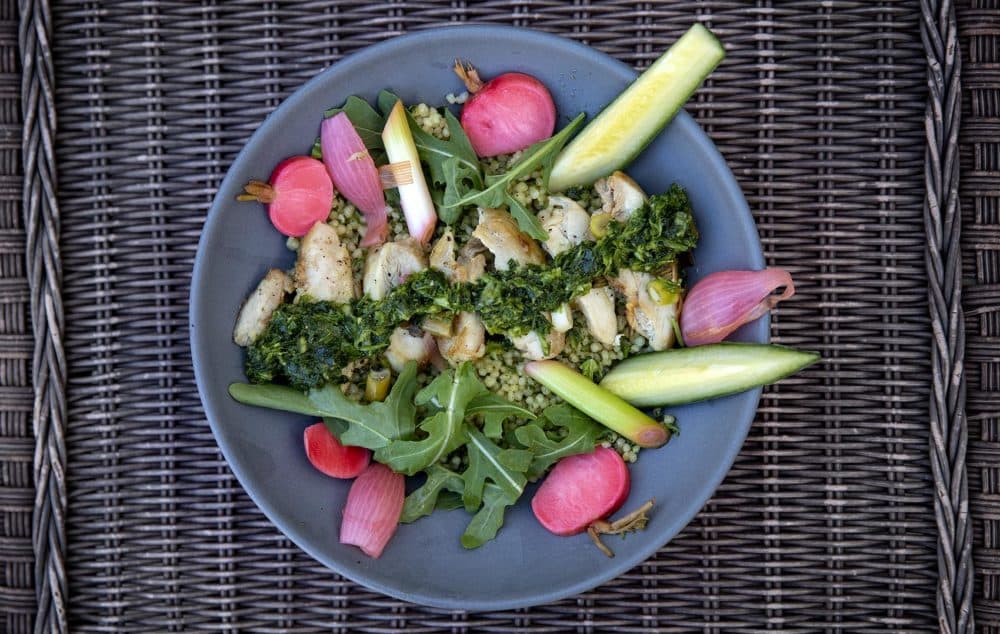 Chef Kathy Gunst’s chicken and couscous bowl with green cilantro-scallion sauce. (Robin Lubbock/WBUR)