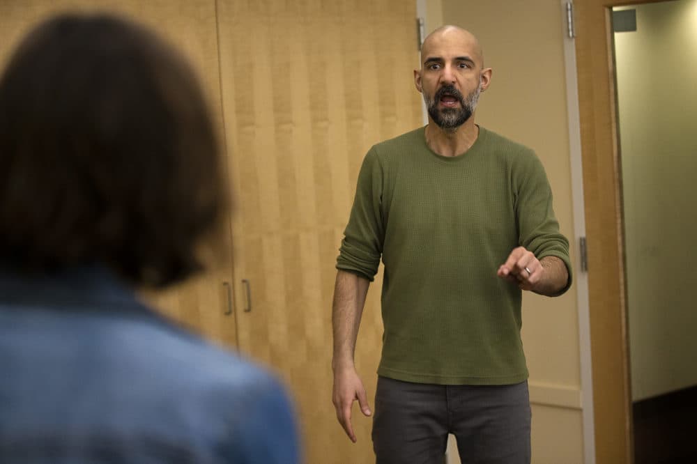 Actors Nael Nacer and Philana Mia rehease a scene from "The Return." (Jesse Costa/WBUR)