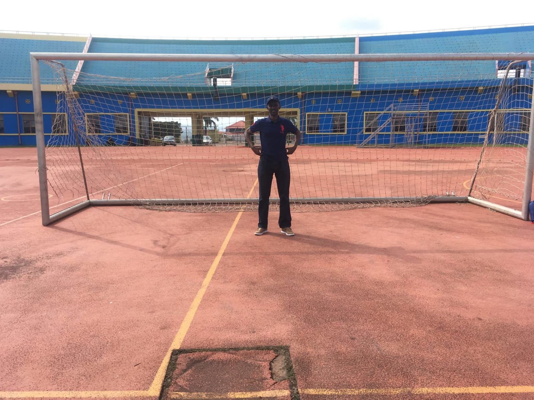 Eric Murangwa at Rayon Sports' stadium. (Shaina Shealy for WBUR)