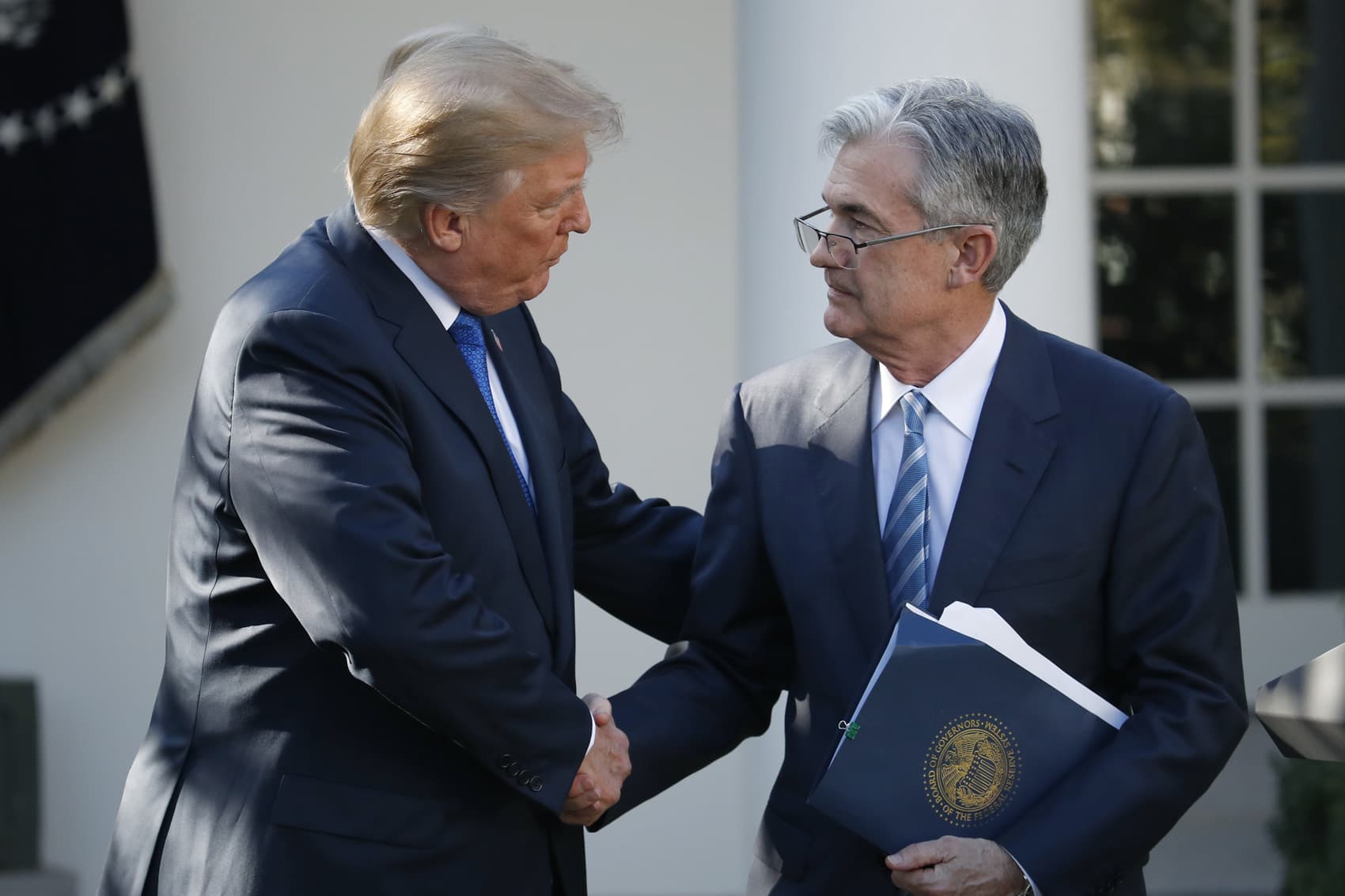 President Donald Trump shakes hands with then-Federal Reserve board member Jerome Powell after announcing him as his nominee for the next chair of the Federal Reserve, in the Rose Garden of the White House in Washington, Nov. 2, 2017. (Alex Brandon, File/AP)