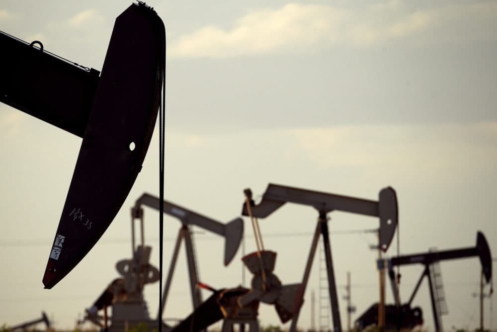 In this April 24, 2015 file photo, pump jacks work in a field near Lovington, N.M. (Charlie Riedel, File/AP)