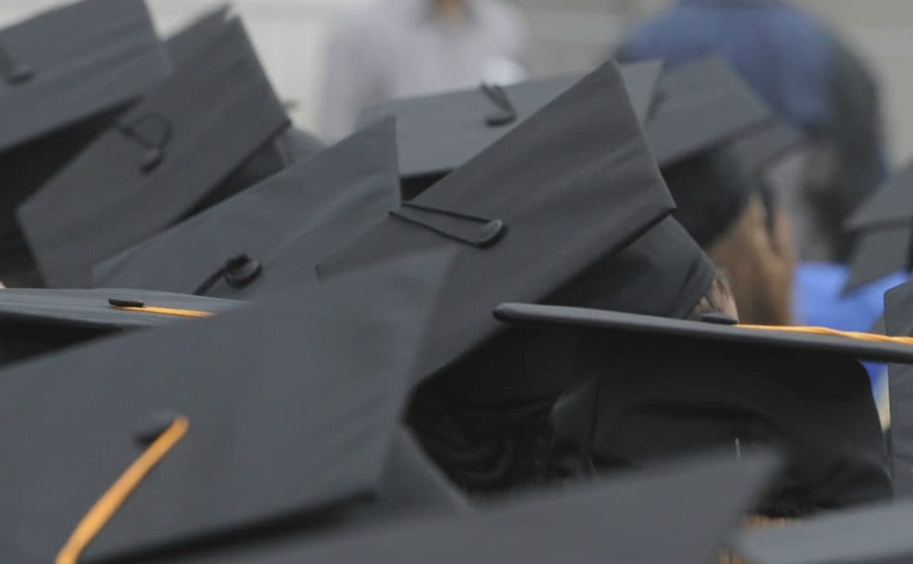 Graduates listen to speakers during the University of Massachusetts Boston's 2009 commencement. (Lisa Poole/AP)