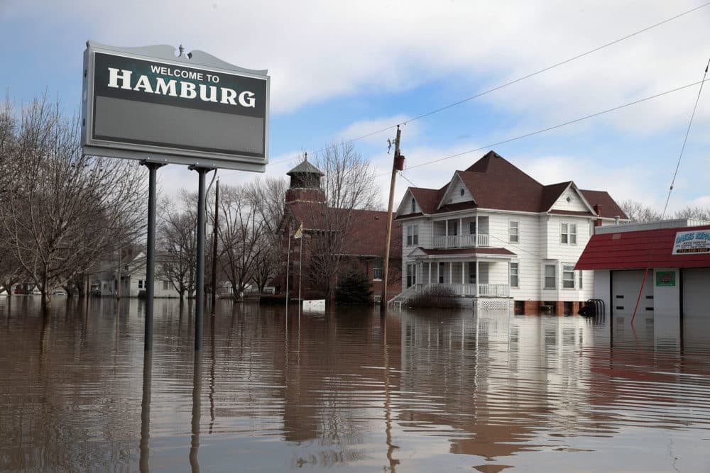 A home sits in flood water in Hamburg, Iowa. Although flood water in the town has started to recede many homes and businesses remain surrounded by water. (Scott Olson/Getty Images)