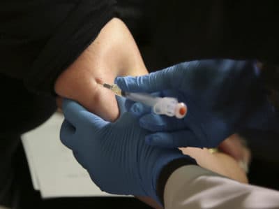 A woman receives a measles, mumps and rubella vaccine at the Rockland County Health Department in Pomona, N.Y., Wednesday, March 27, 2019. The county in New York City's northern suburbs declared a state of emergency. (AP Photo/Seth Wenig)
