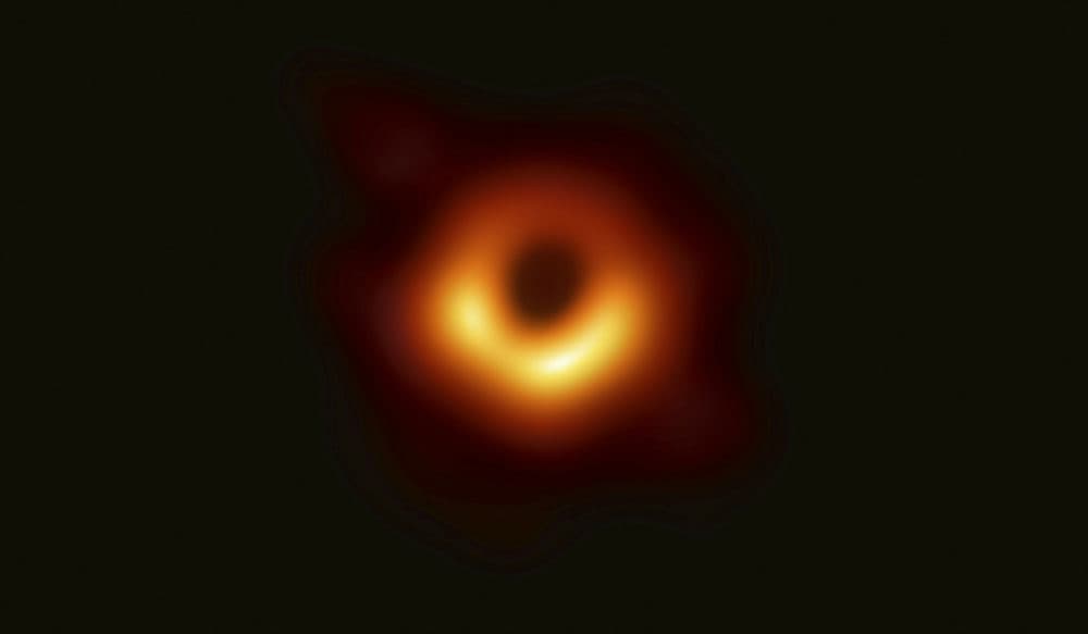 In 2019, scientists revealed the first image ever made of a black hole after assembling data gathered by a network of radio telescopes around the world. (Event Horizon Telescope Collaboration/Maunakea Observatories via AP) 