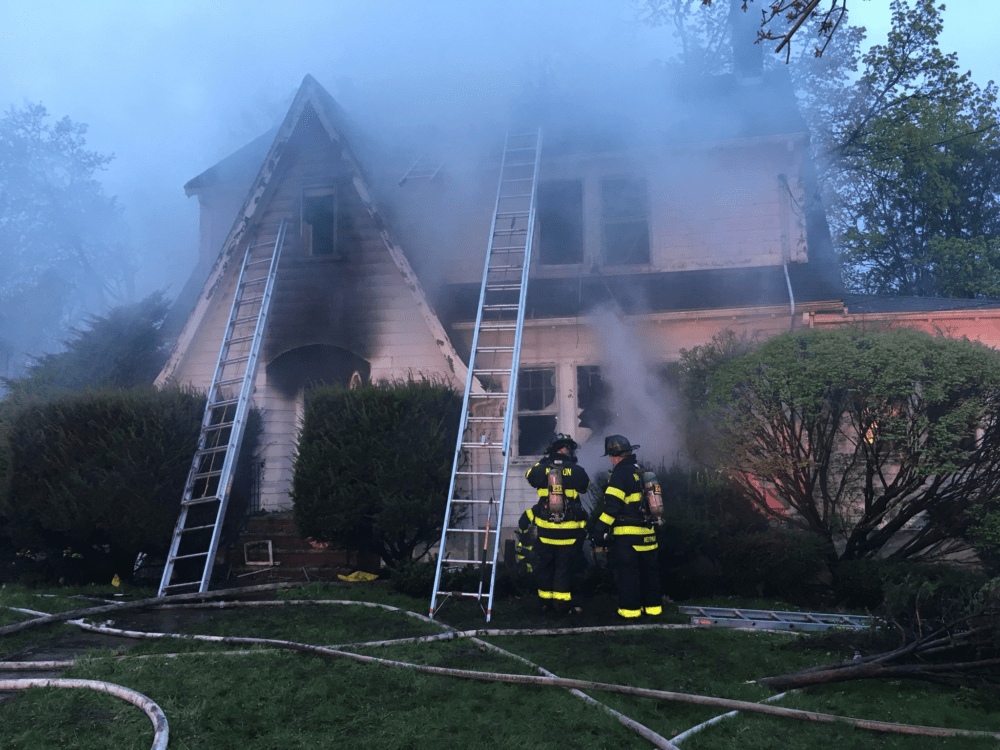 Fire officials said they encountered hoarding conditions in an Oxford Road home that caught fire Saturday morning. (Courtesy the Newton Fire Department via Twitter)