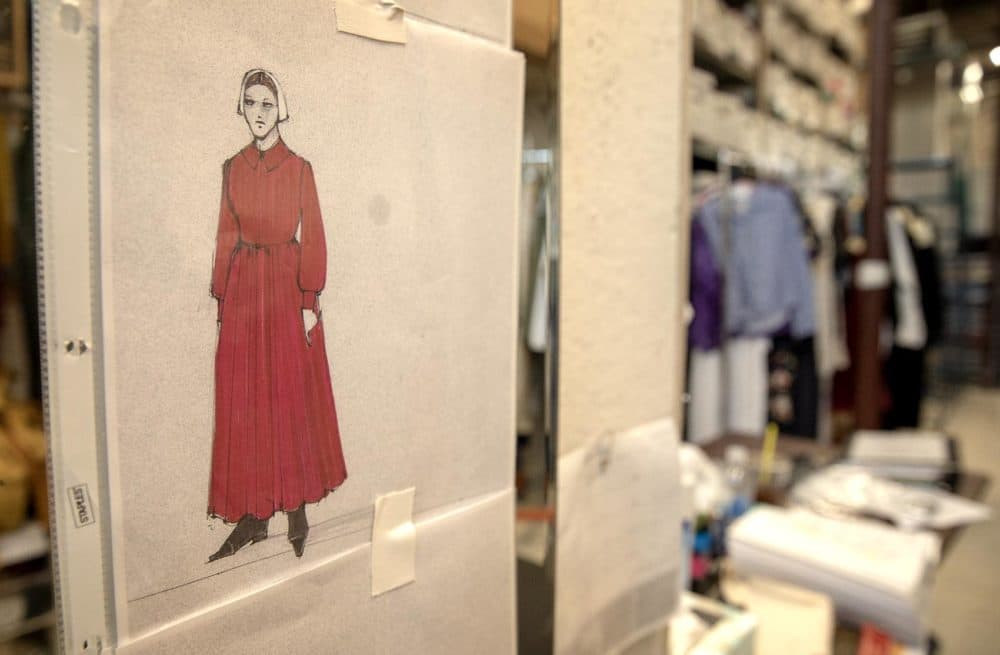 A Handmaid's costume sketch on a dressing room wall at Costume Works. (Robin Lubbock/WBUR)