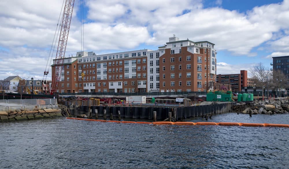 The 99 Sumner St. construction site in East Boston sits between LoPresti Park and Carlton Wharf. (Jesse Costa/WBUR)