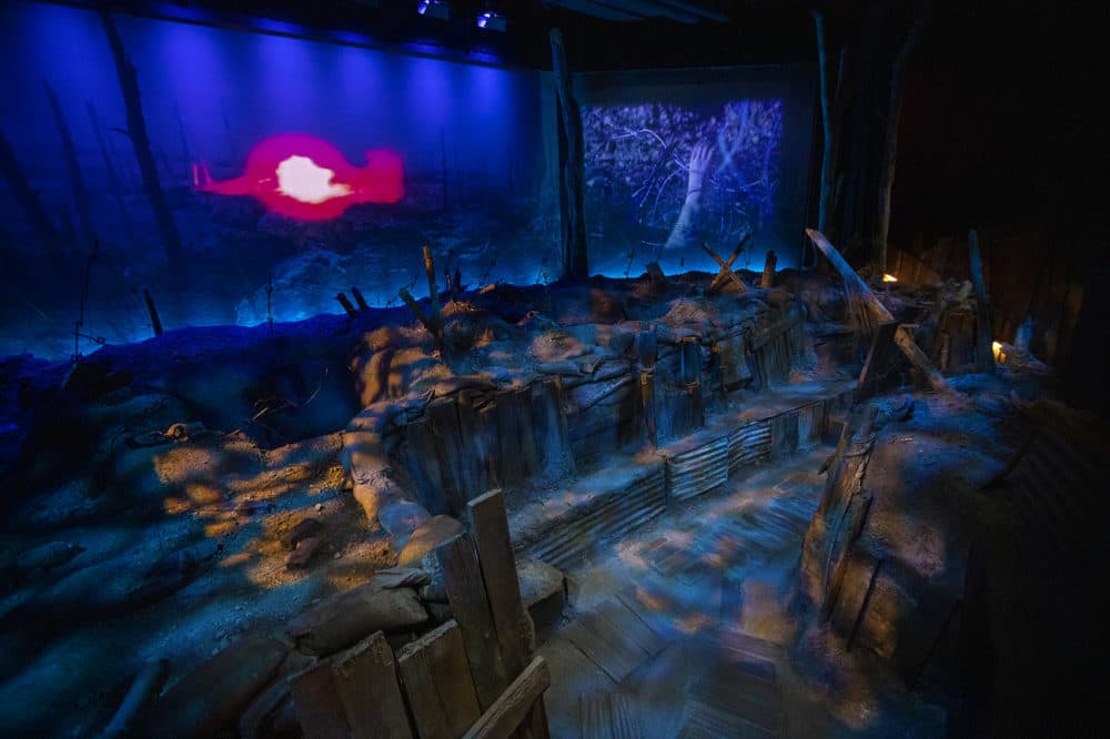 The "World War I Trench Experience" exhibit is part of the orientation theater where visitors can walk down into and explore. (Jesse Costa/WBUR)