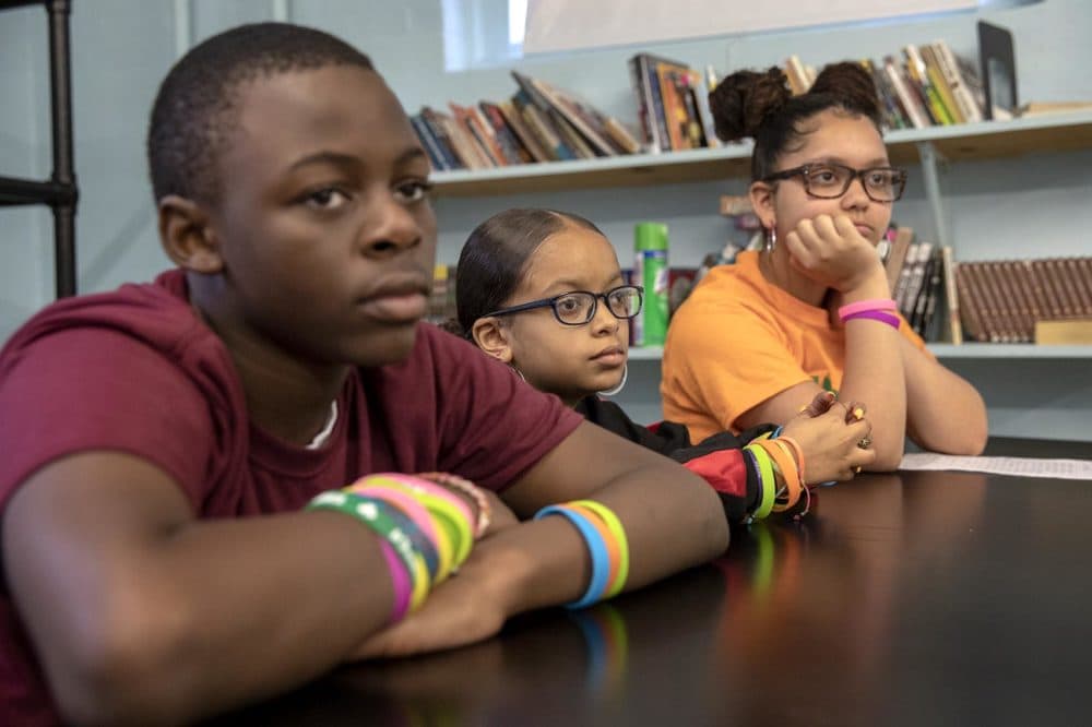 From left: Seventh graders DJ Mitchell, Trinity Raye and Ariani (who preferred not to give her last name) at the Helen Y. Davis Leadership Academy Charter Public School in Dorchester (Robin Lubbock/WBUR)