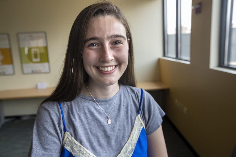 Sarah Groustra, a Brookline High School graduate, wrote a column in the school newspaper about period stigma last year. That led to Brookline voting to become the first municipality to offer free pads and tampons in all town-owned restrooms. (Jesse Costa/WBUR)