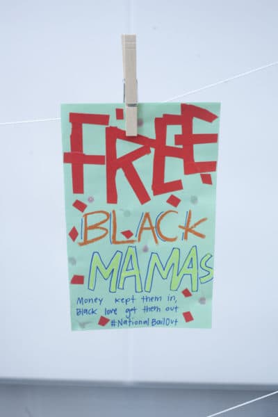 A flyer at the Wee Free Black Mamas bailout event. (OJ Slaughter for WBUR)