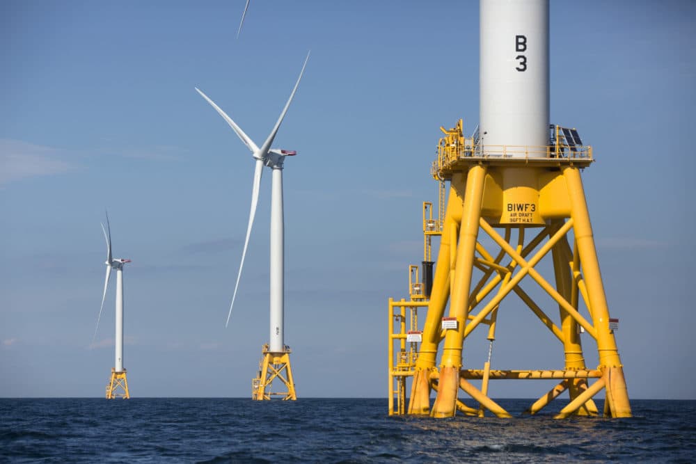 Three of Deepwater Wind's five turbines stand in the water off Block Island, Rhode Island, seen in August 2016. Vineyard Wind, a new 400-megawatt wind farm south of Martha's Vineyard, remains on schedule to begin construction in 2019. (Michael Dwyer/AP)