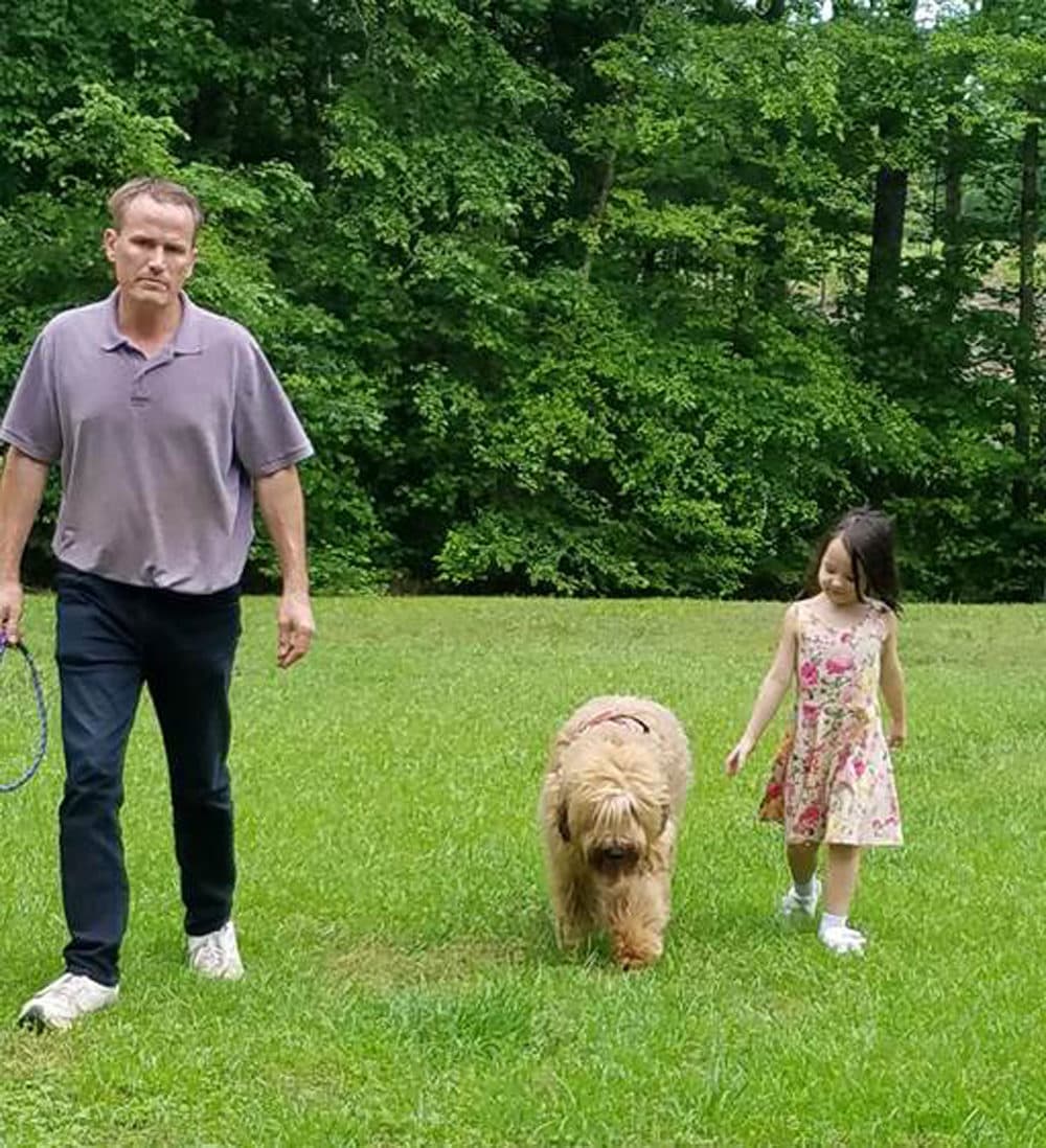 Rebecca Peluso's daughter Ella with her “service dog” Puzzle and Mark Mathis, the "service dog" trainer. (Photo courtesy of Rebecca Peluso)