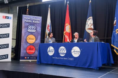 Walter Isaacson (middle) and Gemma Birnbaum join David Folkenflik at The National WWII Museum. (Tracie Morris Schaefer for WWNO)