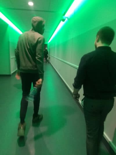 Kane Pitman walking with Bucks star Giannis Antetokounmpo. (Dan Simmons for WBUR)