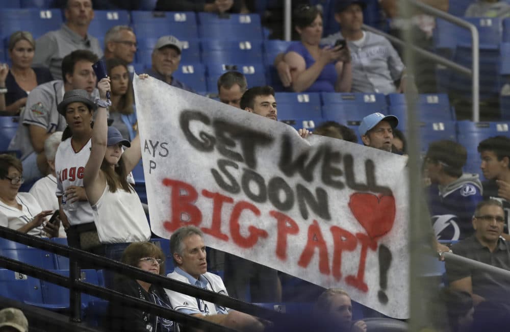 Tampa Bay Rays fans hold up a sign with encouraging words for former Boston Red Sox player David Ortiz during the Rays' game against the Los Angeles Angels on Thursday. (Chris O'Meara/AP)