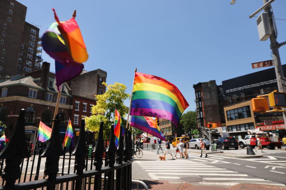 Rainbow pride flags fly outside the Stonewall Inn as crowds begin to gather to celebrate Pride Month in New York City. (Spencer Platt/Getty Images)